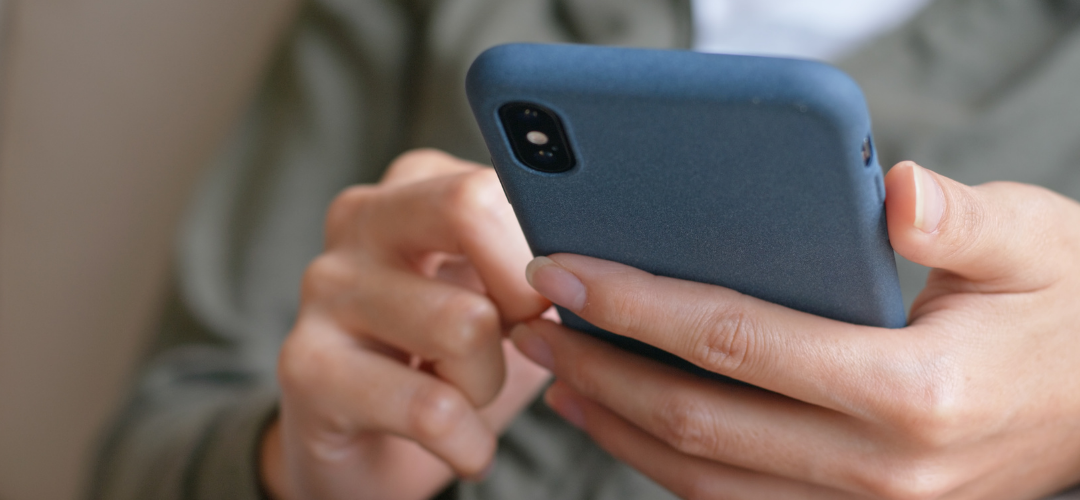 hands using a mobile phone