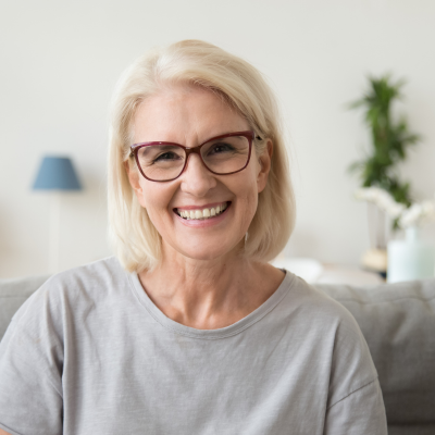 woman in grey t shirt and dark glasses
