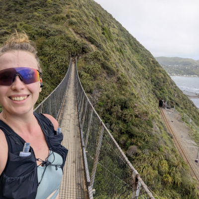 Marathon runner on a bridge next to a mountain