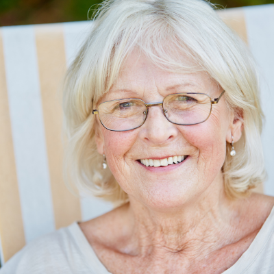 Older woman looking at camera smiling