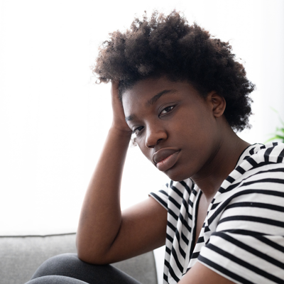 woman in stripey top looking at camera